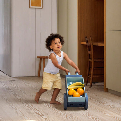 MODU 3-in-1 baby walker deep blue met fruit, gebruikt door klein kind in modern interieur