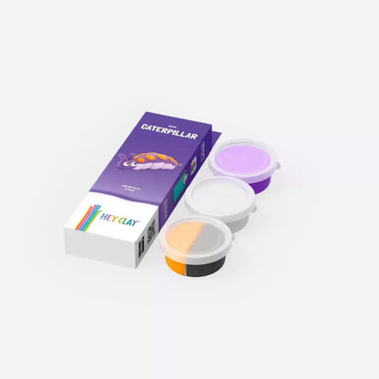 Hey Clay Caterpillar set met 3 potjes klei in paarse verpakking, drie open bakjes met paarse, witte en oranje klei ernaast