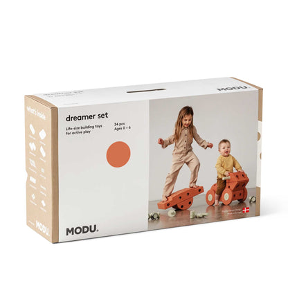 MODU Dreamer Set verpakking met twee speelende kinderen op oranje bouwblokken, 34 stuks, leeftijd 0-6 jaar