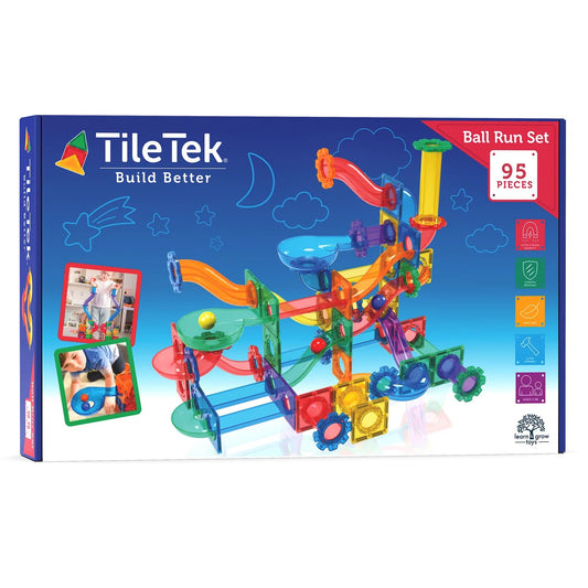 Learn and Grow Toys magnetische tegels ballrun set met 95 stuks, verpakking met kleurrijke knikkerbaan-constructie op blauwe achtergrond