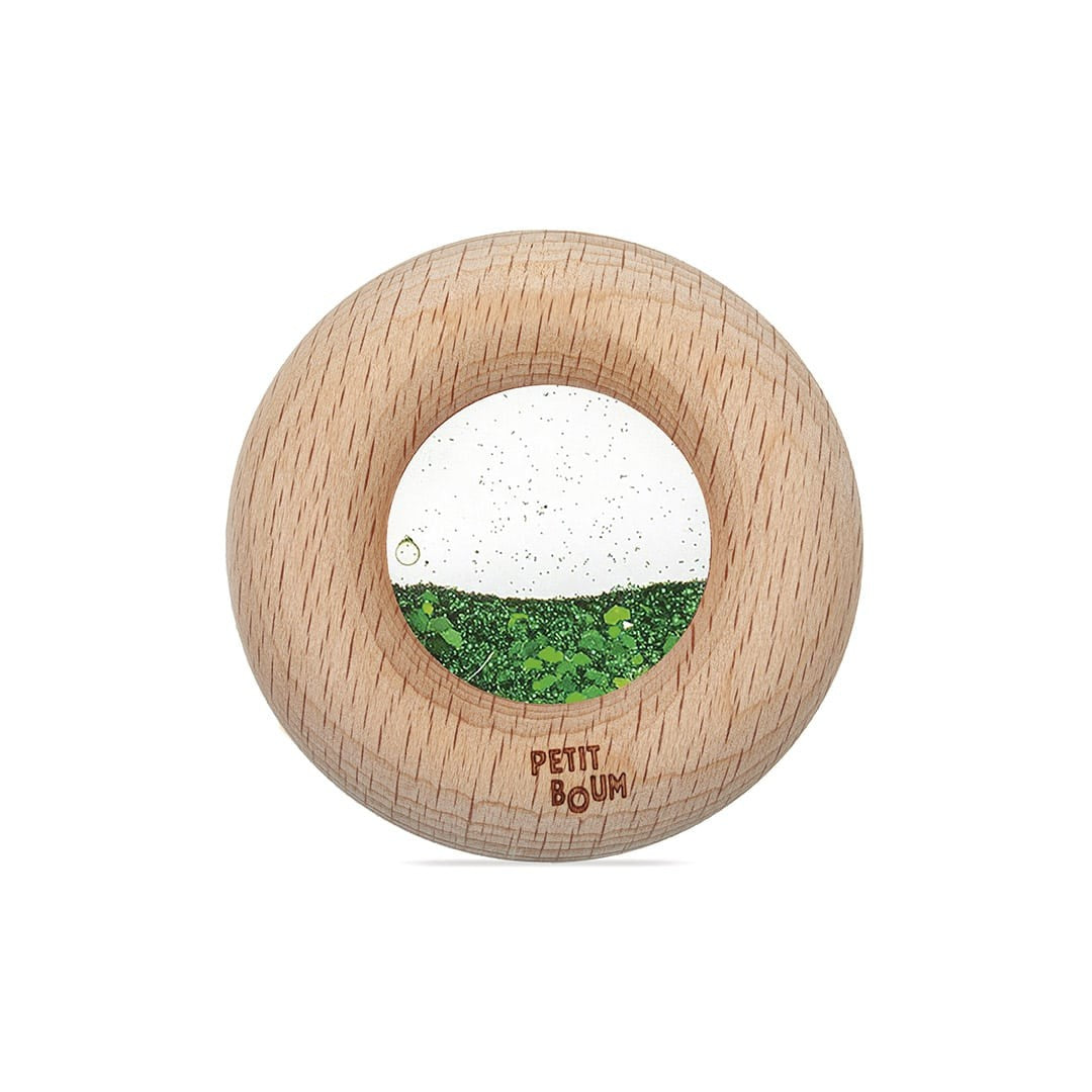 Petit Boum sensorische donut groen met houten ring, vooraanzicht met zichtbare glitter beweging