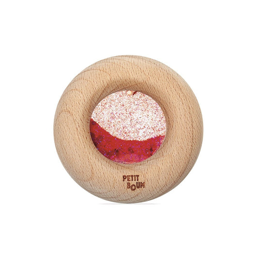 Petit Boum sensorische calm donut in rood met houten ring en glitter, bovenaanzicht op witte achtergrond