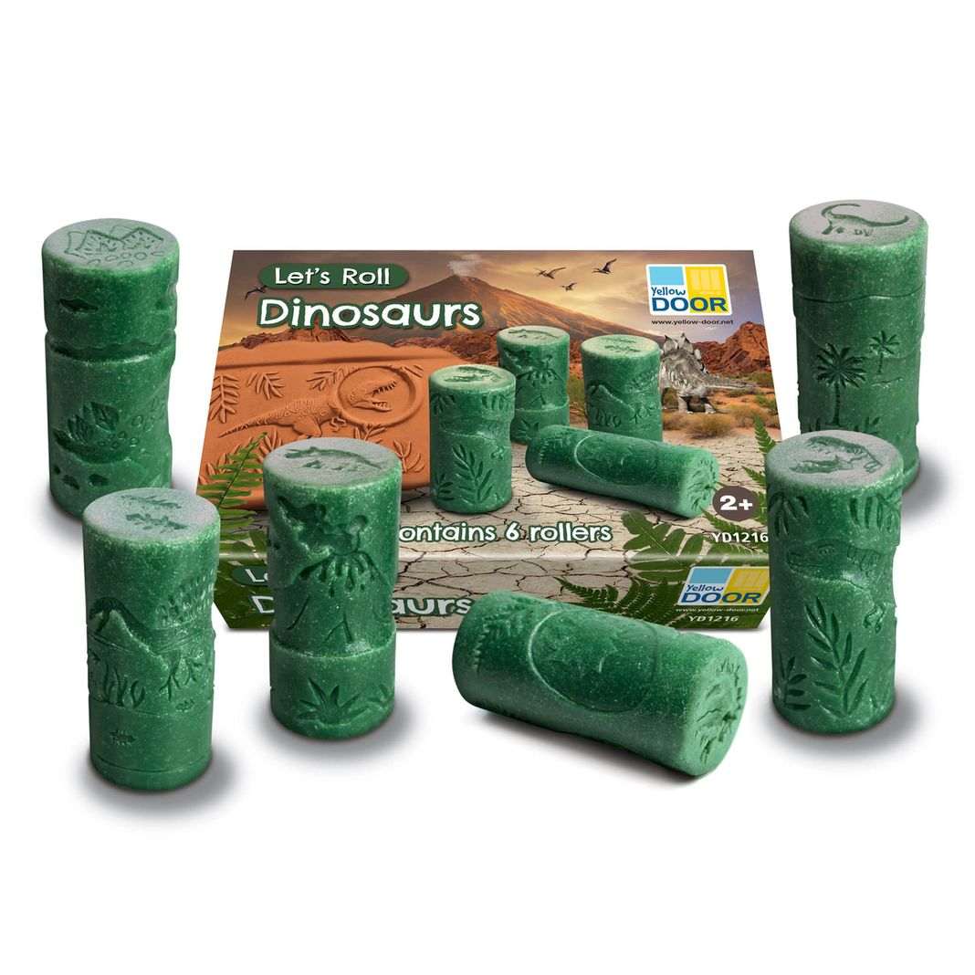 Yellow Door Let's Roll Dinosaurus set met 6 groene kleirollers met dino-motieven, uitgelijnd rond productdoos met prehistorisch landschap